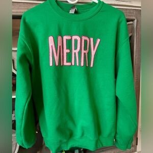 Green sweater with pink Merry